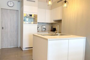 Fridge, oven, coffee/tea maker, dining tables - Cozy Coastal Apartment with Dual Terraces (MIDDELKERKE)