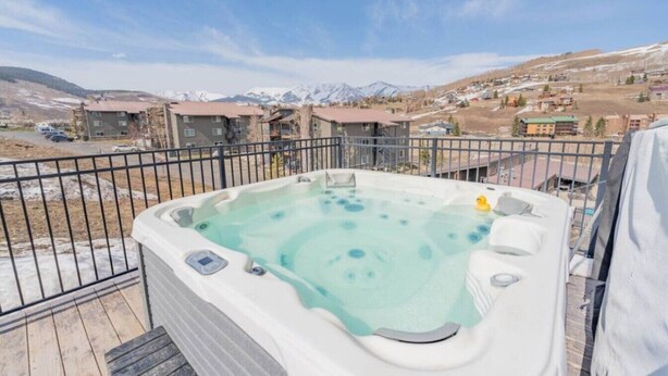 A hot tub on a balcony with a mountain view. - The Peachtree Paradise: Hot Tub, Free Shuttle (Crested Butte)