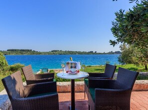 Outdoor dining - FourBedroom Beachfront Villa with Pool (Okrug Donji)