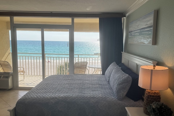 Living area / king size bed with balcony, overlooking the beach.