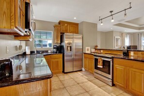 Fridge, microwave, oven, stovetop - Tamp Retreat | 3BR 2bth W/ Workspace + Patio Oasis (Tampa)