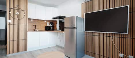 Fridge, microwave, stovetop, coffee/tea maker
