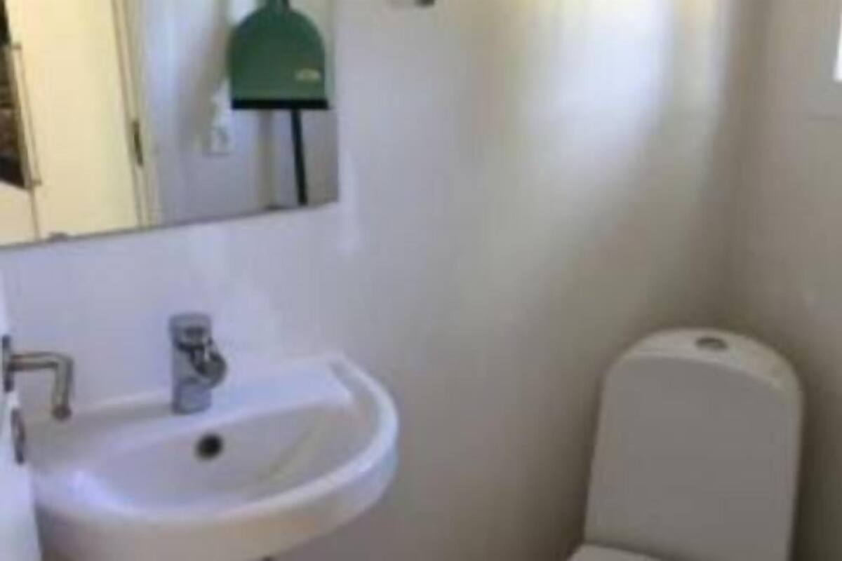 A bathroom with a sink and toilet.