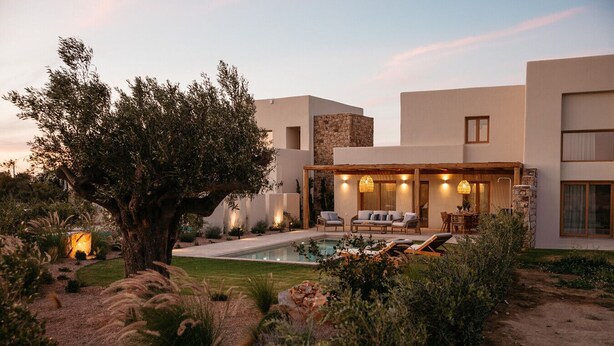 A modern house with a pool, outdoor seating, and a large tree. - VILLA KERAMEAS PLAKA NAXOS (Plaka)