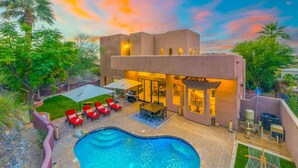 A modern house with a swimming pool, outdoor furniture, and a patio area. - NEW | HTD Pool | Firepit | Biltmore | Piestewa (Phoenix)