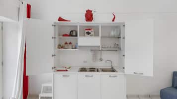 Fridge, stovetop, coffee/tea maker, cookware/dishes/utensils