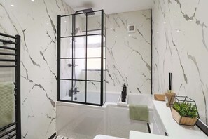 Shower, hair dryer, towels, soap