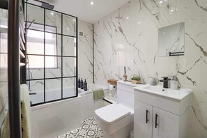 Shower, hair dryer, towels, soap