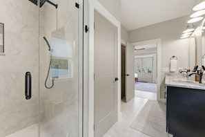 Shower, hair dryer, towels, shampoo