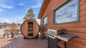 A wooden cabin with a deck, a sauna, and a grill. - Aspen Grove Cabin - Sauna, 3 Decks, Mountain Views, ATV Access (Grand Lake)