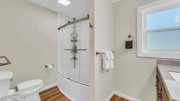 Shower, hair dryer, towels, shampoo
