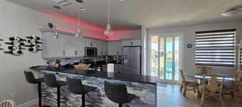 Large 2-bedroom pool house just seconds from secluded beach in Ormond By The Sea