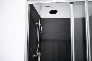 Shower, towels, soap, toilet paper