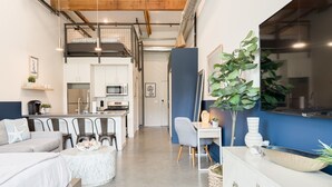 A modern hotel room with a kitchenette, a dining area, and a large window. - 5 Miles to Disney & Airport w/ Gym Pet friendly (Santa Ana)