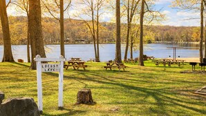 A picnic area with benches and a sign reading 'Locust Lake.' - A-Frame Escape | Firepit Nights + Lake Days (Coolbaugh Township)