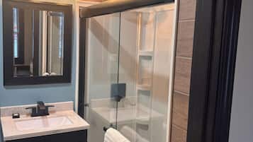 Shower, hair dryer, towels, soap