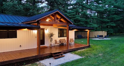 Lovely 2-bedroom cottage with covered porch, hot tub and campfire area.