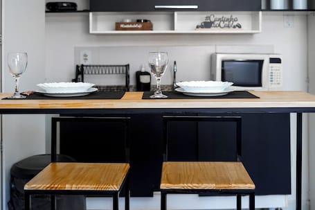 Dining. Studio Comfort with air conditioning, Wi-Fi, and workspace in the city center, kitchen, and close to the ferry terminal.