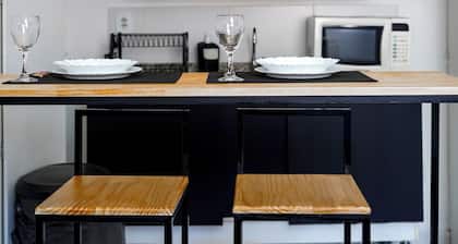 Studio Comfort with air conditioning, Wi-Fi, and workspace in the city center, kitchen, and close to the ferry terminal.