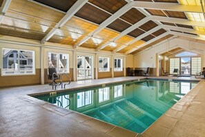 An indoor swimming pool with a high ceiling, large windows, and a view of the outside. - Surfside at Short Sands - 3 min walk to Short Sands - York - Pool - Hot Tub (York)