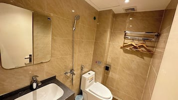Standard Room | Bathroom | Hair dryer, slippers, towels, soap