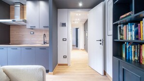 A modern kitchen with grey cabinets, a white countertop, and a built-in stove. - 2 bedroom lovely apartment in Santa Margherita (Santa Margherita)