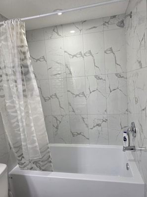 Bidet, towels, toilet paper