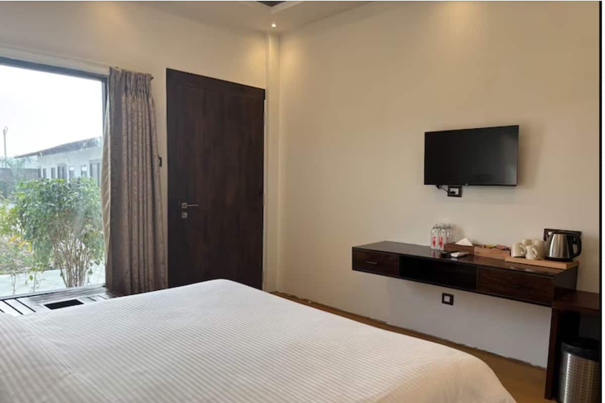 Quarto luxo, vista para o jardim