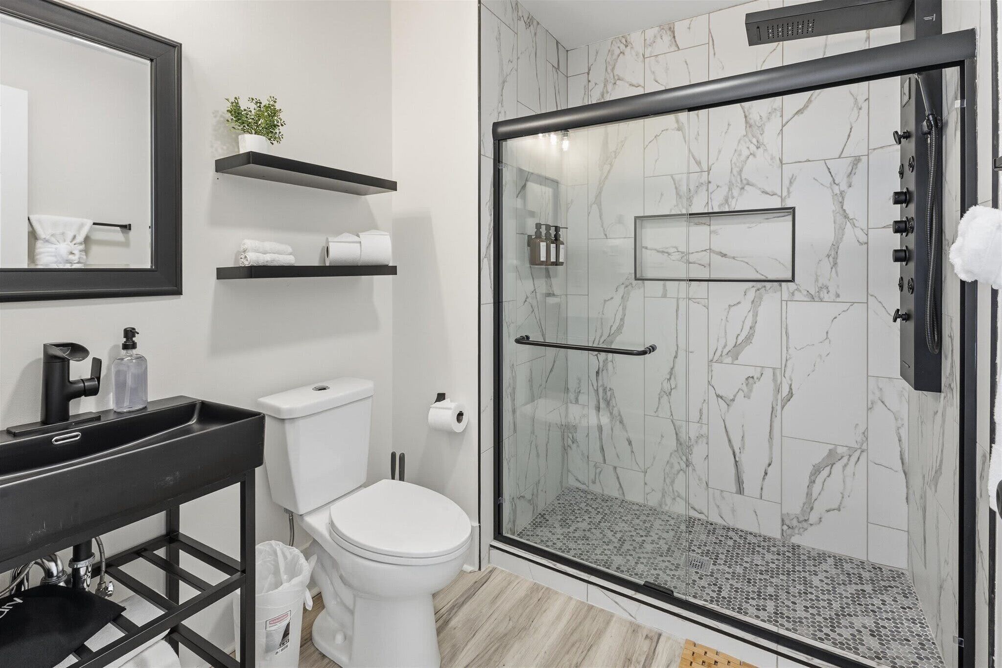 Shower, hair dryer, towels, shampoo