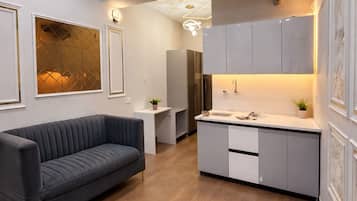 Estúdio superior, 1 quarto | Área de estar