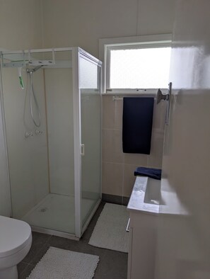 Shower, hair dryer, towels, soap