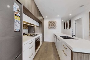 Fridge, microwave, oven, stovetop - Skyline 2-Bed Apartment Near Metro North Ryde (North Ryde)