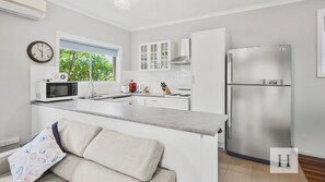 Coffee/tea maker, cookware/dishes/utensils, dining tables - Eloora Cottage - Beachside Escape in Long Jetty (Long Jetty)