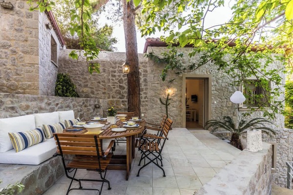 Private Courtyard with Outdoor Seating and Rustic Stone Walls