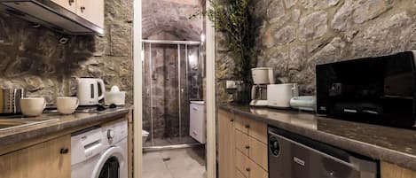 Fridge, coffee/tea maker, toaster, cookware/dishes/utensils