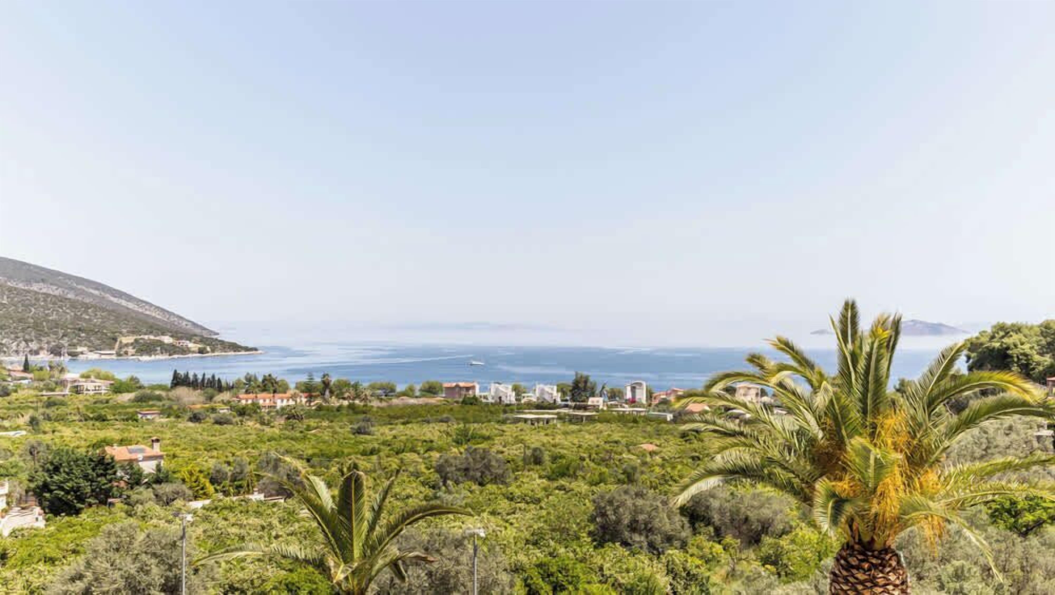 Garden View with Mediterranean Plants and Sea in Distance