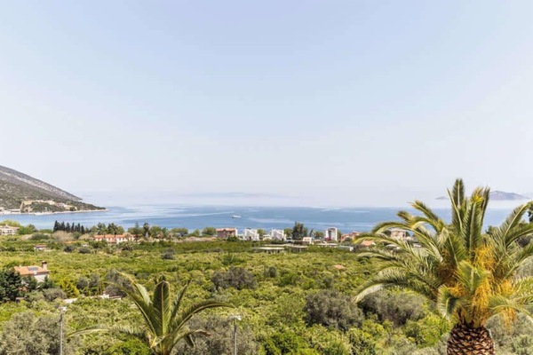 Garden View with Mediterranean Plants and Sea in Distance