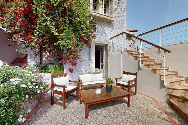 Private Courtyard with Outdoor Dining and Stone Staircase