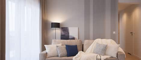 Deluxe Suite, City View | Living area