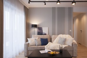 Deluxe lakosztály, kilátással a városra | Nappalirész
