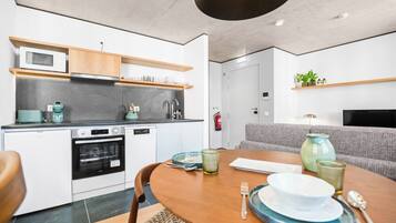 Comfort Apartment, Non Smoking | Private kitchen | Mini-fridge, microwave, oven, stovetop