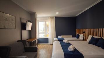 Familie driepersoonskamer, uitzicht op de stad