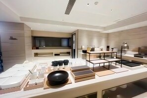 A modern kitchen with a central island, built-in appliances, and a minimalist design. - Ji Hotel Wuhan Hankou Xinhua Road (Wuhan)