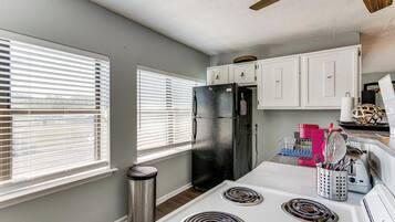 Fridge, microwave, stovetop, coffee/tea maker