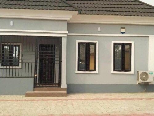 Charming Executive Suite with Garden Views at AJALA Lodge, Badagry