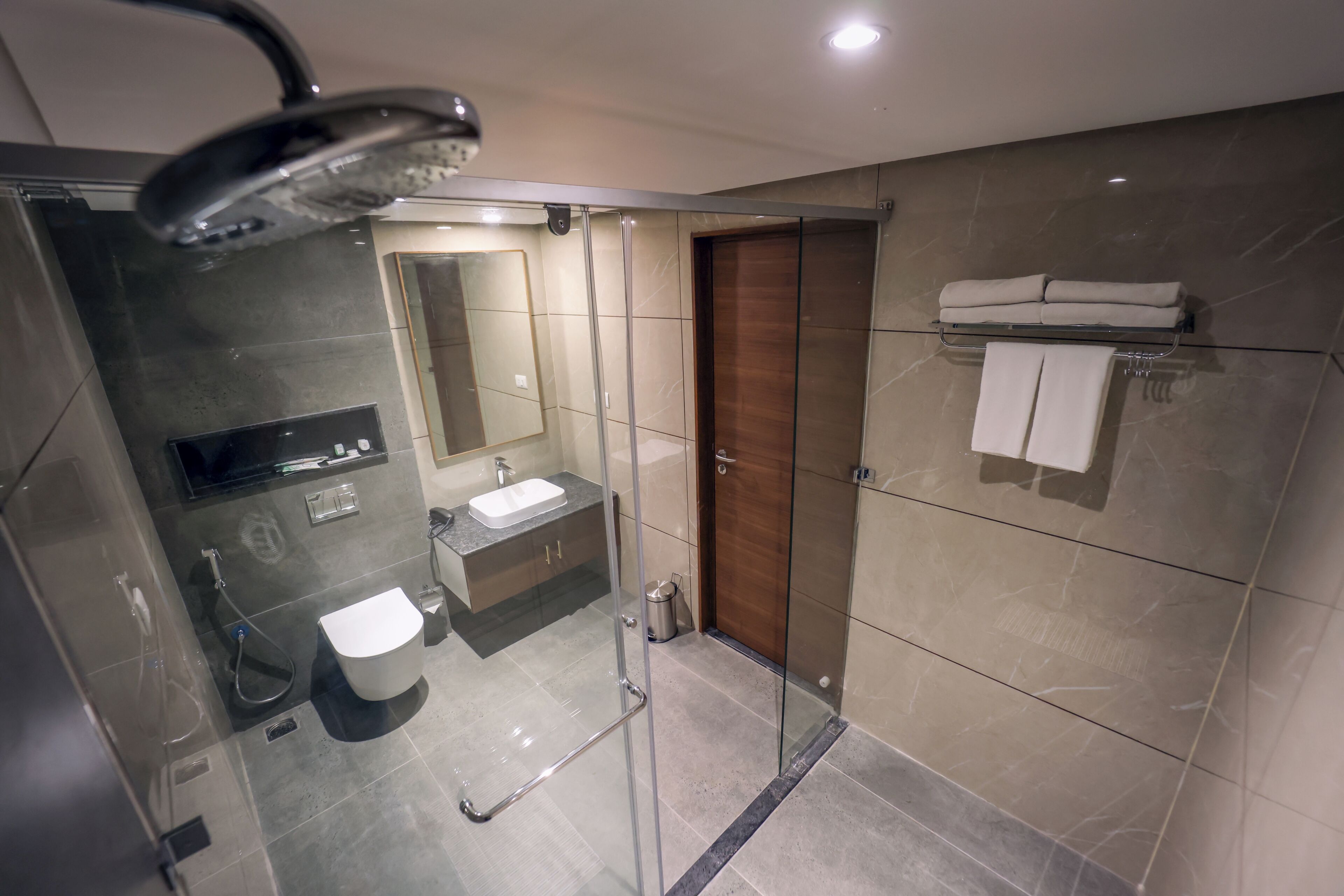 Shower, rainfall showerhead, towels, soap
