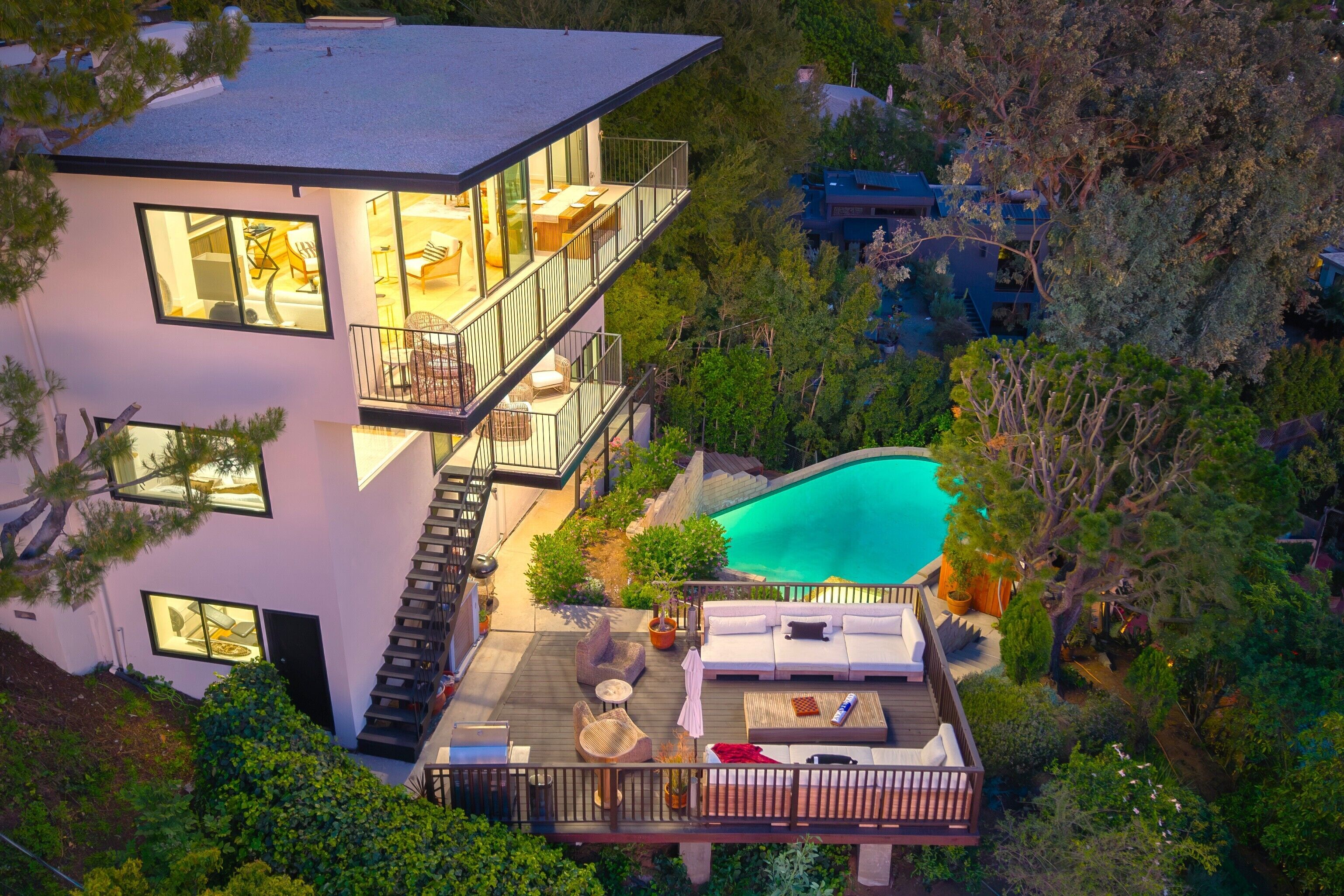 Perched above the hills, this striking retreat pairs panoramic views with a private pool, expansive deck, and seamless indoor-outdoor living.