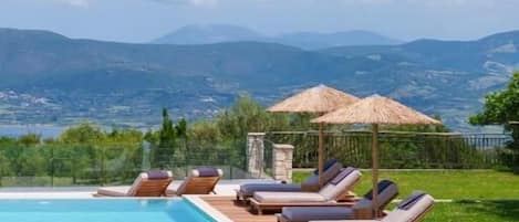 Seasonal outdoor pool, pool umbrellas, pool loungers