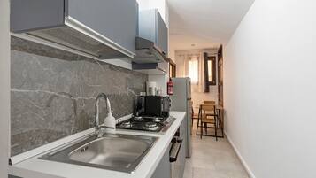 Fridge, microwave, stovetop, coffee/tea maker