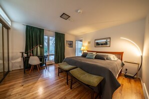 A bedroom with a bed, desk, chair, and bench. - Luxury Pool Home Near FIFA 2026 World Cup KC (Kansas City)